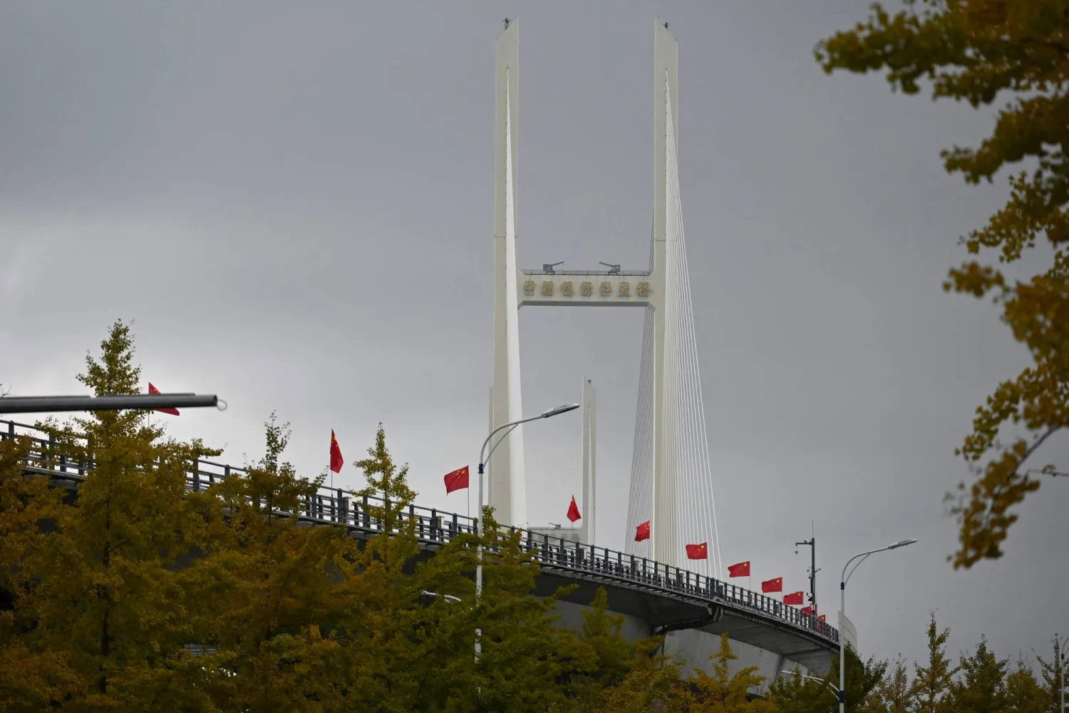 A general view shows the new cross-border bridge linking China and North Korea in Dandong, Liaoning Province, on October 15, 2026. (Photo by Michael ZHANG / AFP)