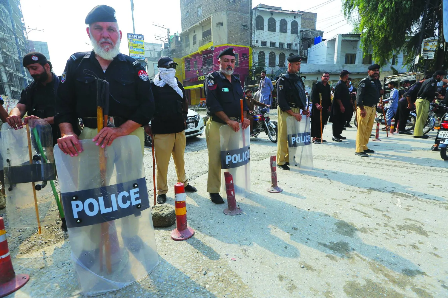 Pakistani security officials stand guard amid roadblocks in Peshawar, Pakistan, 11 October 2026, amid heightened security during the Pakistan Tehreek-e-Insaf (PTI) long march. EPA/ARSHAD ARBAB