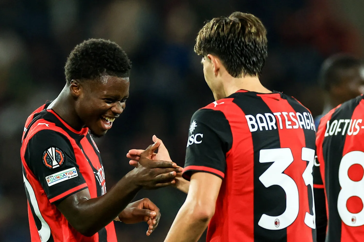 AC Milan's Alphadjo Cisse (L) celebrates with Davide Bartesaghi of AC Milan after scoring the 2-0 lead during the UEFA Europa League match-day 2 between FC Salzburg and AC Milan, Austria, 15 October 2026. (EPA)