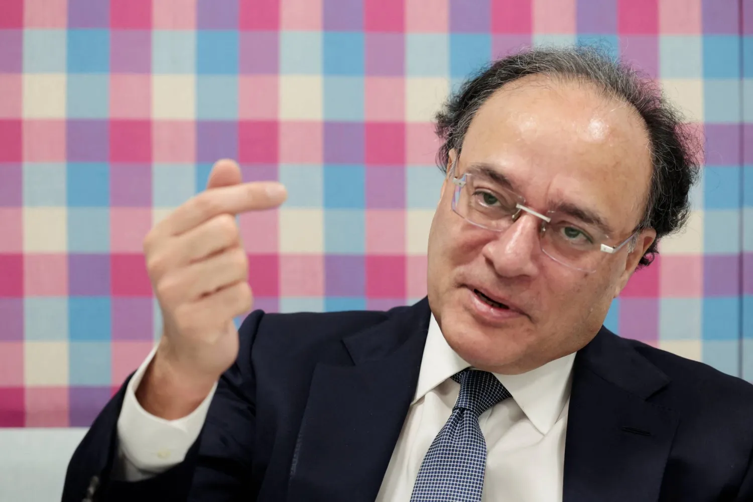 Pakistan Finance Minister Muhammad Aurangzeb gestures during a Reuters interview in the IMF/World Bank 2026 Annual Meetings at the Queen Sirikit National Convention Center (QSNCC) in Bangkok, Thailand, October 12, 2026. REUTERS/Patipat Janthong