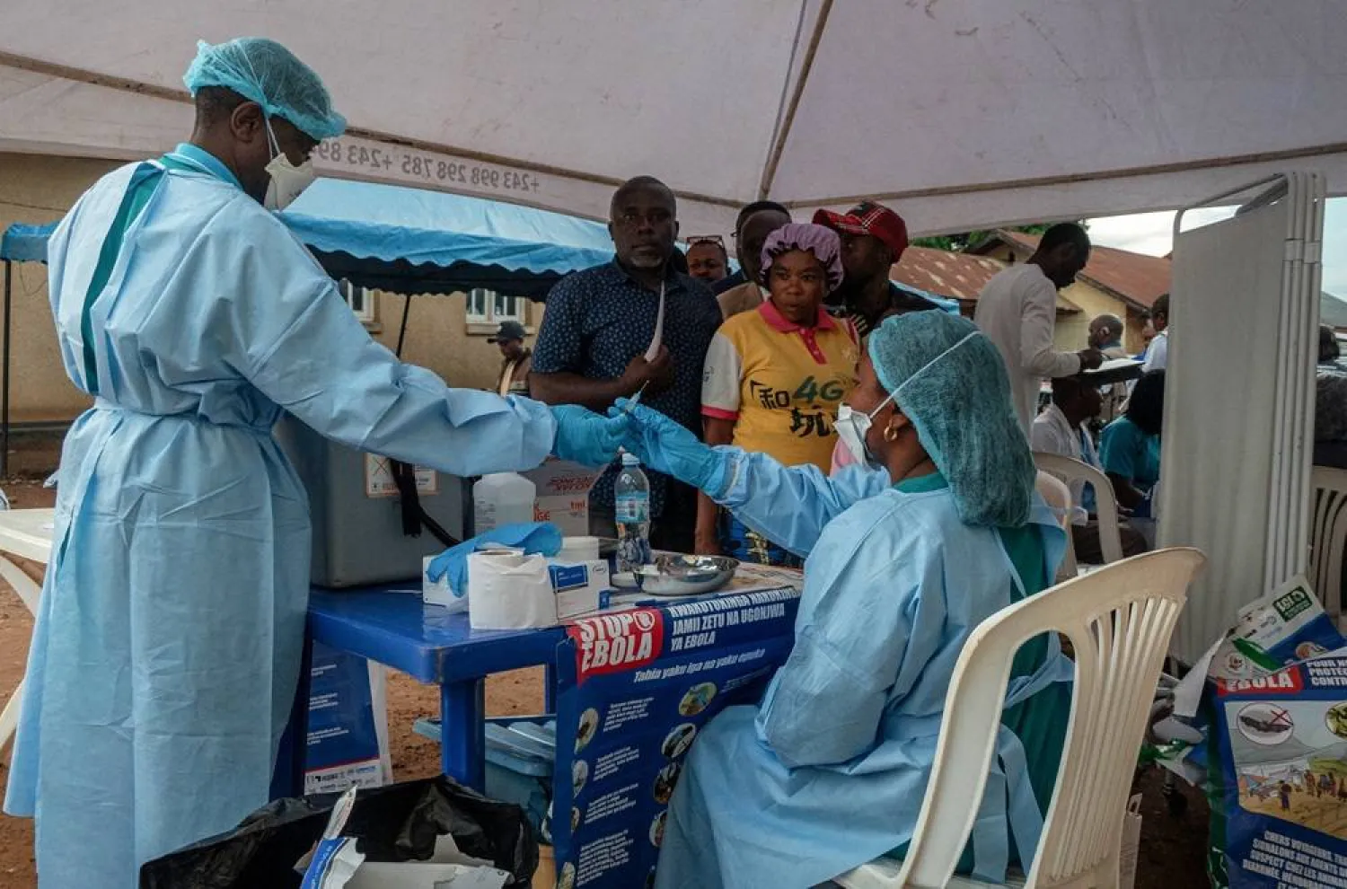 Health workers and humanitarian responders on the front lines of the Ebola response gather to receive a vaccination due to their potential exposure to the virus as part of their work with suspected cases, including contacts, as aid agencies intensify efforts to contain the Ebola outbreak involving the Bundibugyo strain, in the North Kivu Province of the Democratic Republic of the Congo, October 16, 2026. (Reuters)
