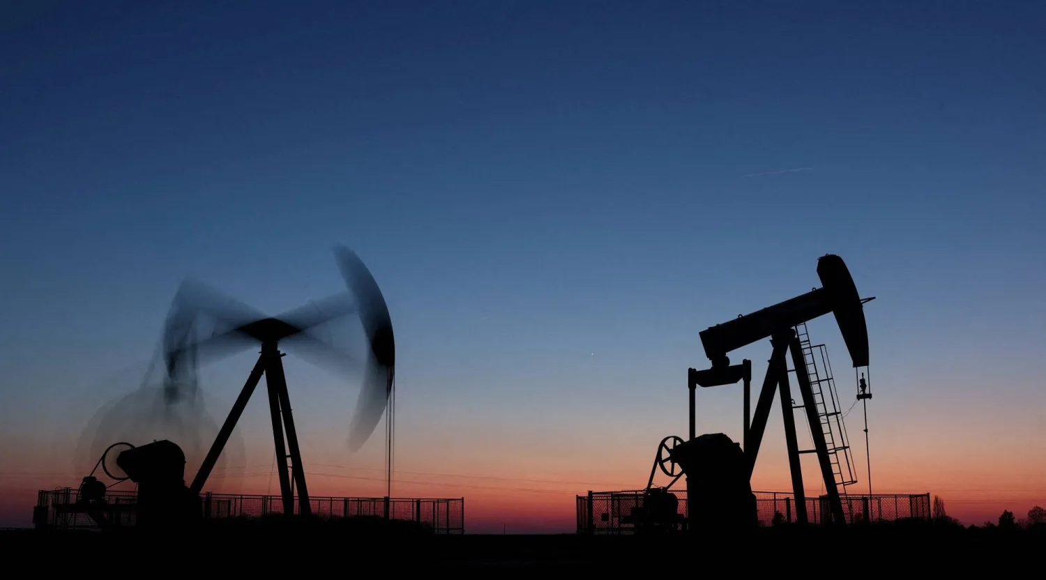 Oil pumps operate after sunset outside Vaudoy-en-Brie, near Paris, France, March 18, 2026. (Reuters)