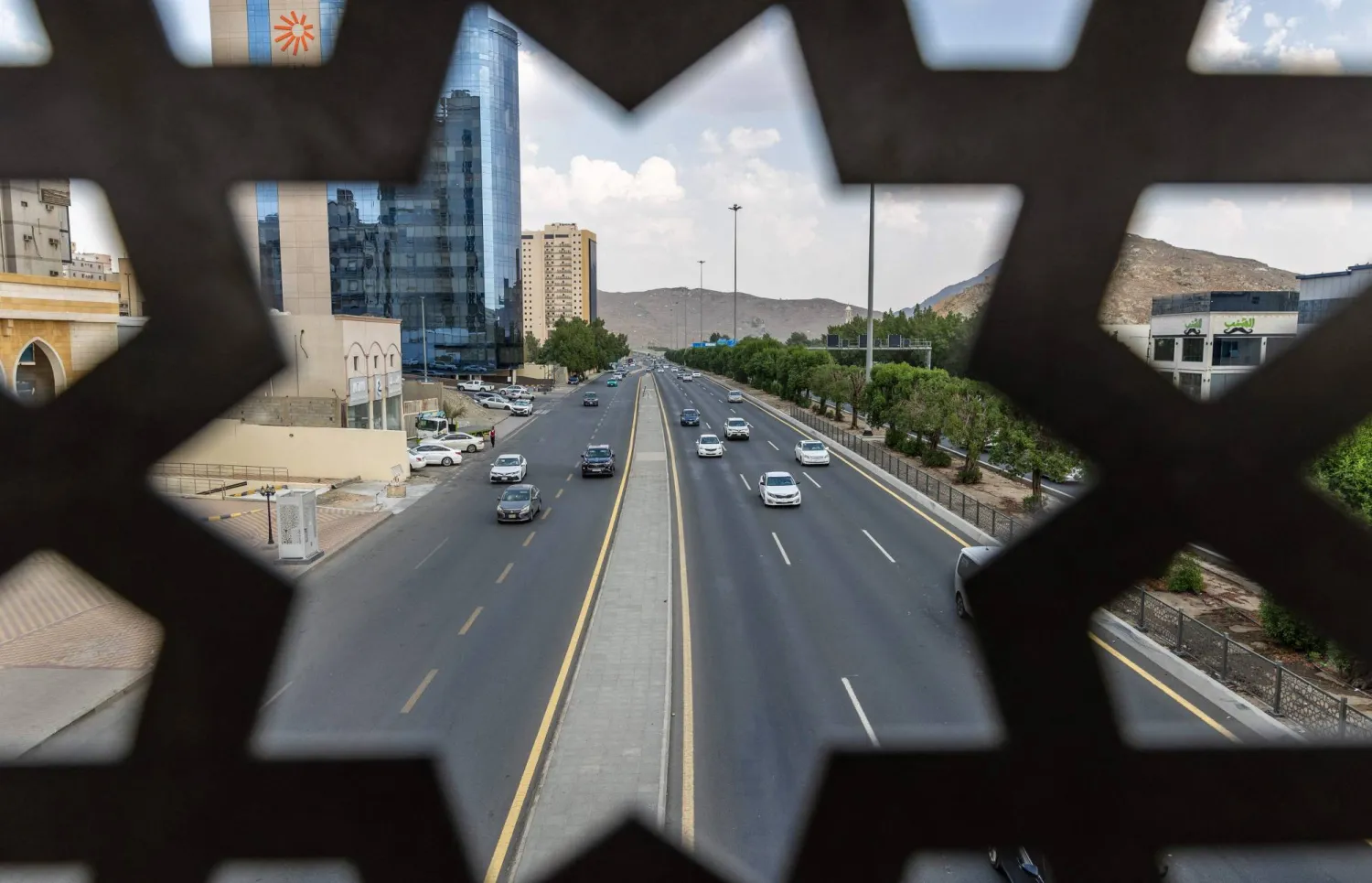 Vehicles drive along a road in Makkah on October 25, 2026. (AFP)