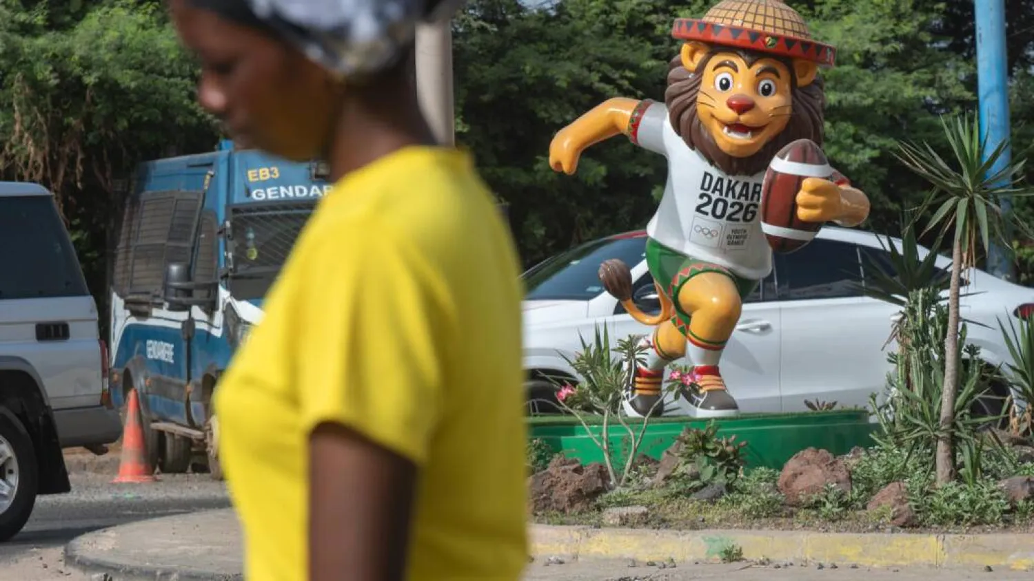 Statues of the Youth Olympics mascot Ayo the lion playing various sports have been installed throughout Dakar. SEYLLOU / AFP
