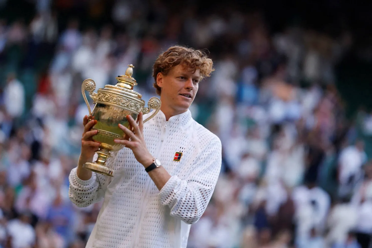 Wimbledon - All England Lawn Tennis and Croquet Club, London, Britain - July 12, 2026 Italy's Jannik Sinner celebrates with the trophy after winning his final match against Germany's Alexander Zverev. (Reuters)