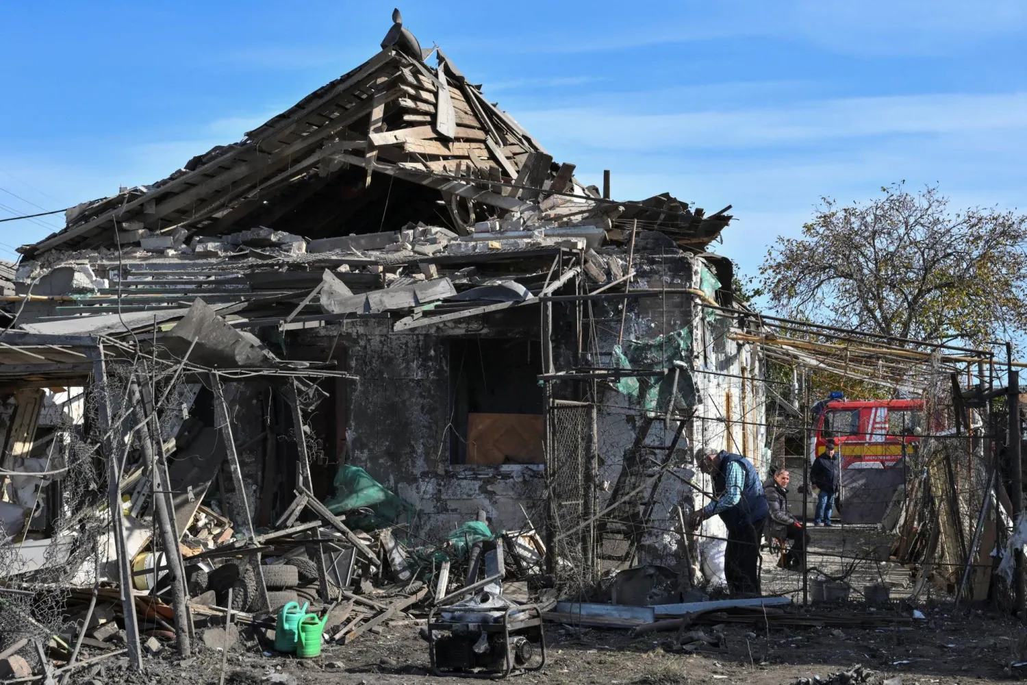 A resident inspects the site of a private house damaged during an overnight Russian drone strike, amid Russia's attack on Ukraine, in Zaporizhzhia, Ukraine October 26, 2026. (Reuters)