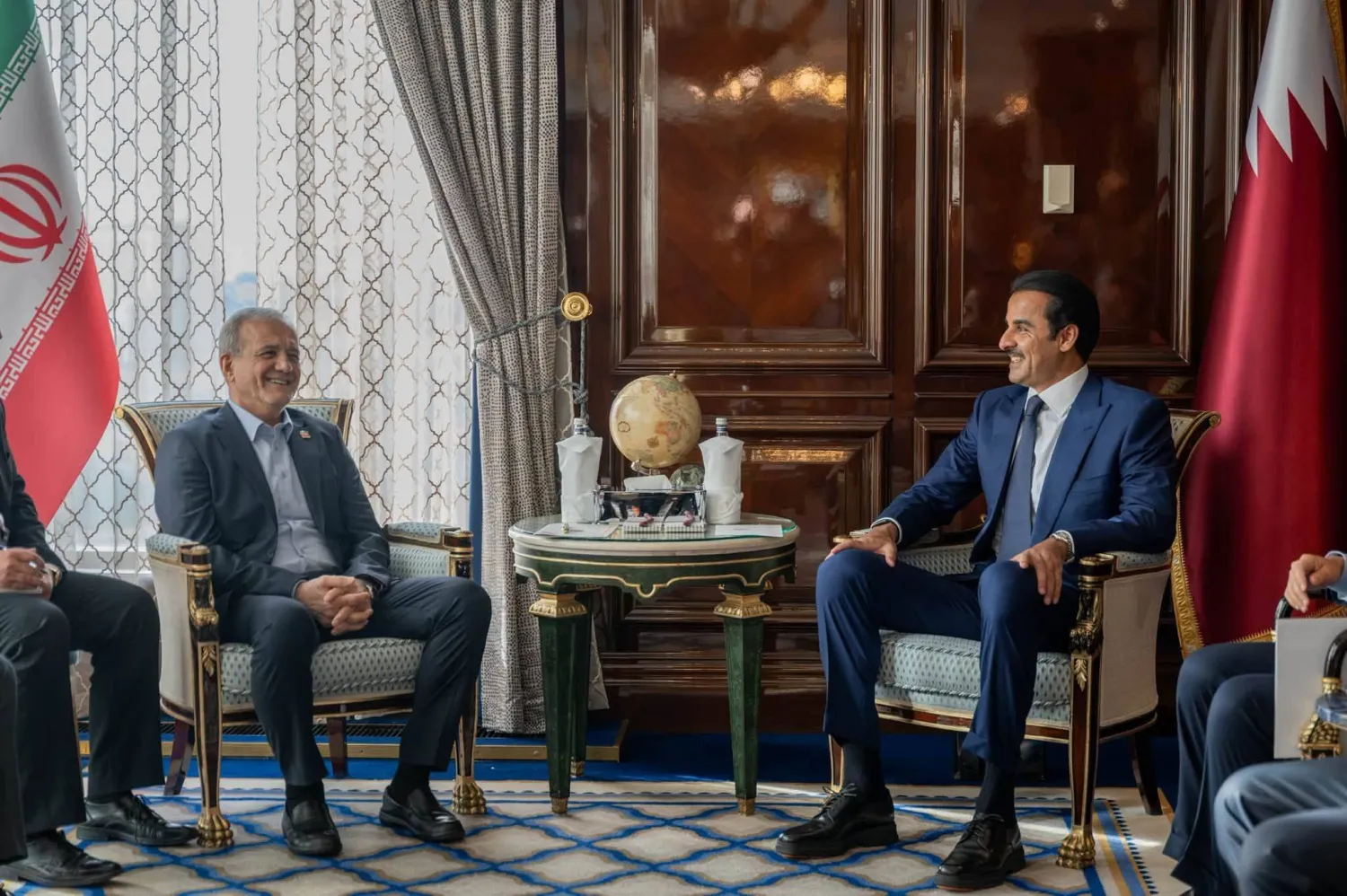 27 October 2026, Russia, Moscow: Qatar's Emir Sheikh Tamim bin Hamad Al Thani meets with Iranian President Masoud Pezeshkian at his residence in Moscow, on the sidelines of the Summit of Heads of State and Government of the Gas Exporting Countries Forum (GECF). (Emiri Diwan Office) 
