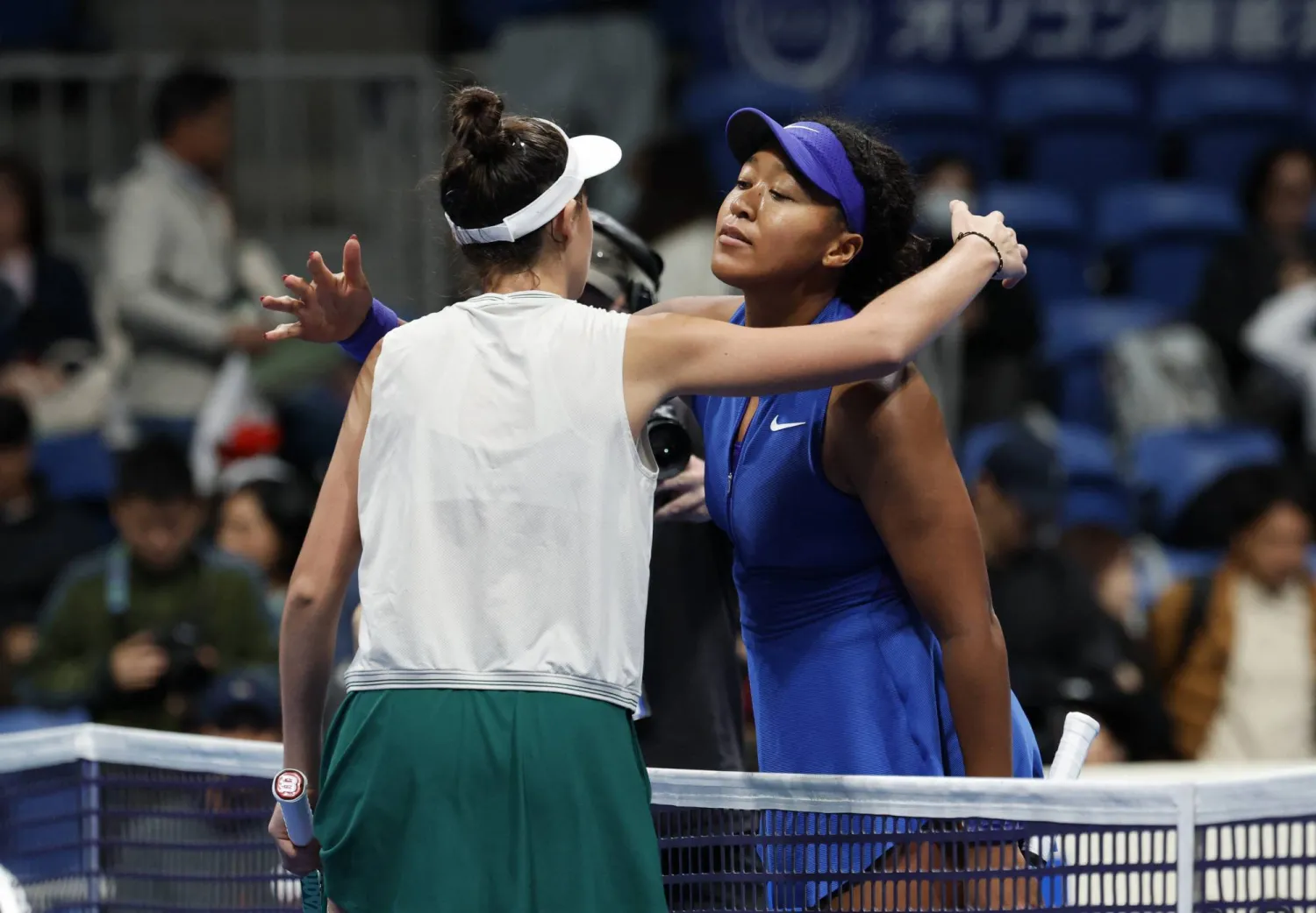 Tennis - WTA 500 - Pan Pacific Open - Ariake Coliseum, Tokyo, Japan - October 29, 2026 Slovakia's Mia Pohankova embraces Japan's Naomi Osaka after winning her round of 16 match REUTERS/Kim Kyung-Hoon