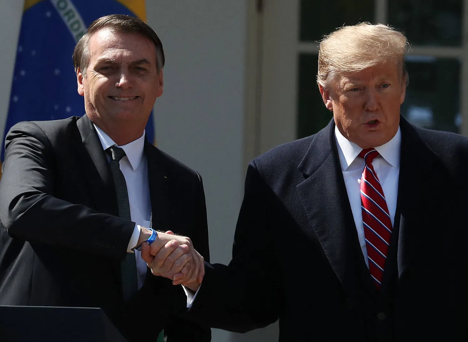 (FILES) WASHINGTON, DC - MARCH 19: US President Donald Trump and Brazilian President Jair Bolsonaro participate shake hands after a joint news conference at the Rose Garden of the White House March 19, 2019 in Washington, DC. President Trump is hosting President Bolsonaro for a visit and bilateral talks at the White House today. (Photo by MARK WILSON / GETTY IMAGES NORTH AMERICA / AFP)