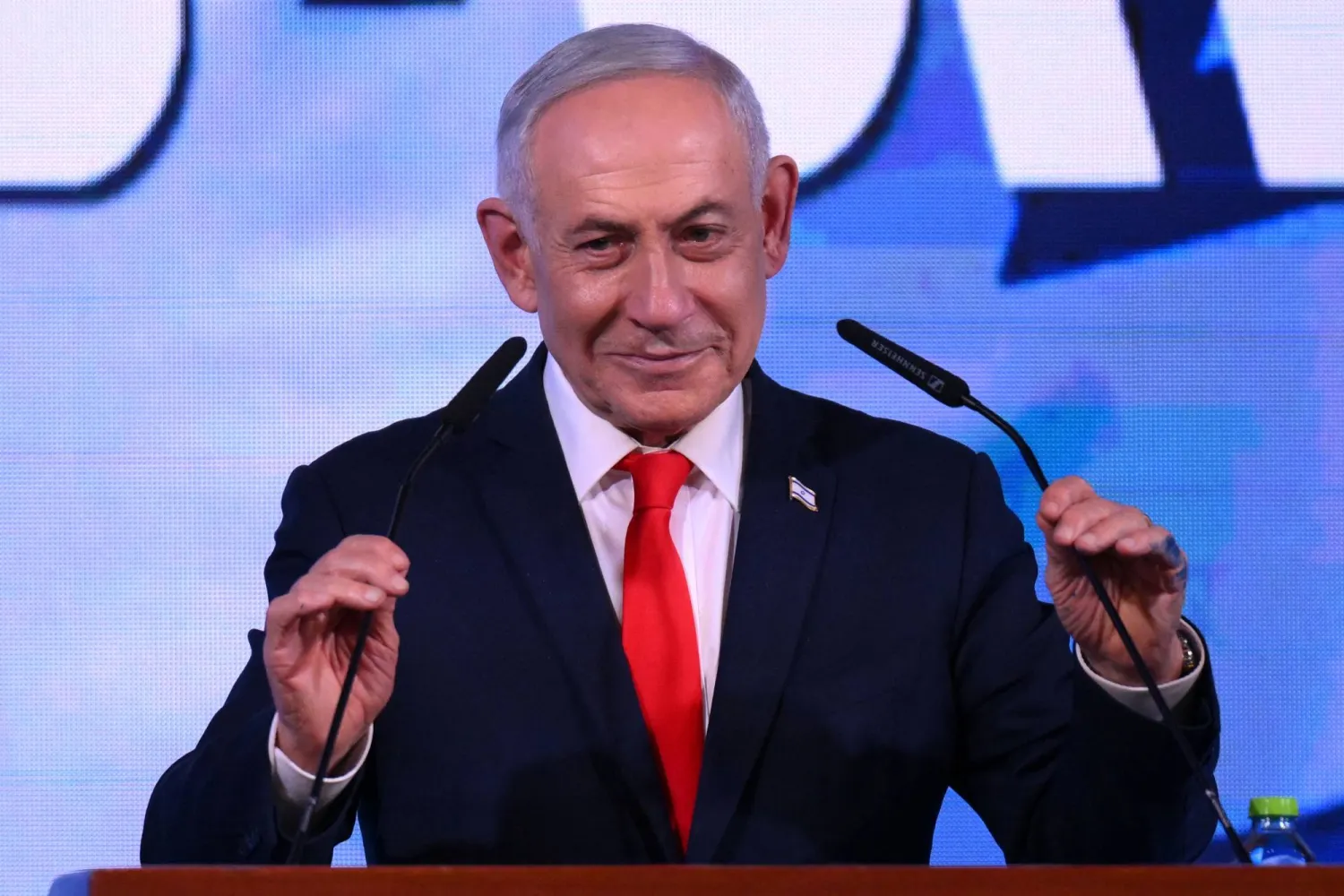 Israel's Prime Minister Benjamin Netanyahu prepares to address his supporters at the election night rally after the first exit polls were announced, in Jerusalem on early October 28, 2026, during Israel's legislative elections.  (Photo by Jewel SAMAD / AFP)