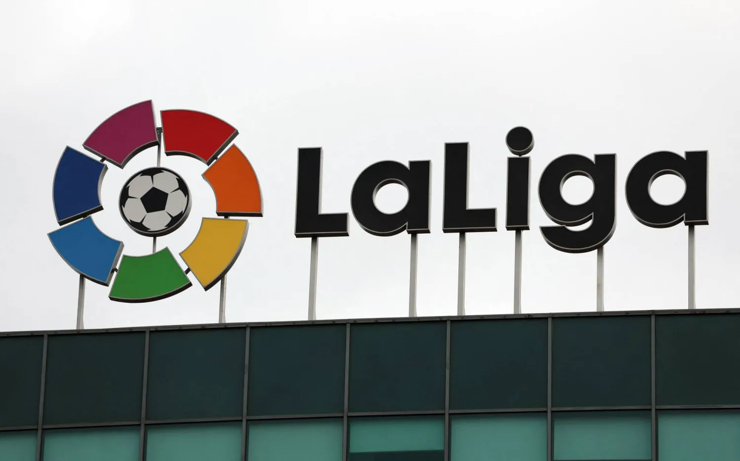 The logo of Spain's La Liga football association stands on top of its headquarters in Madrid on December 20, 2022. (AFP)