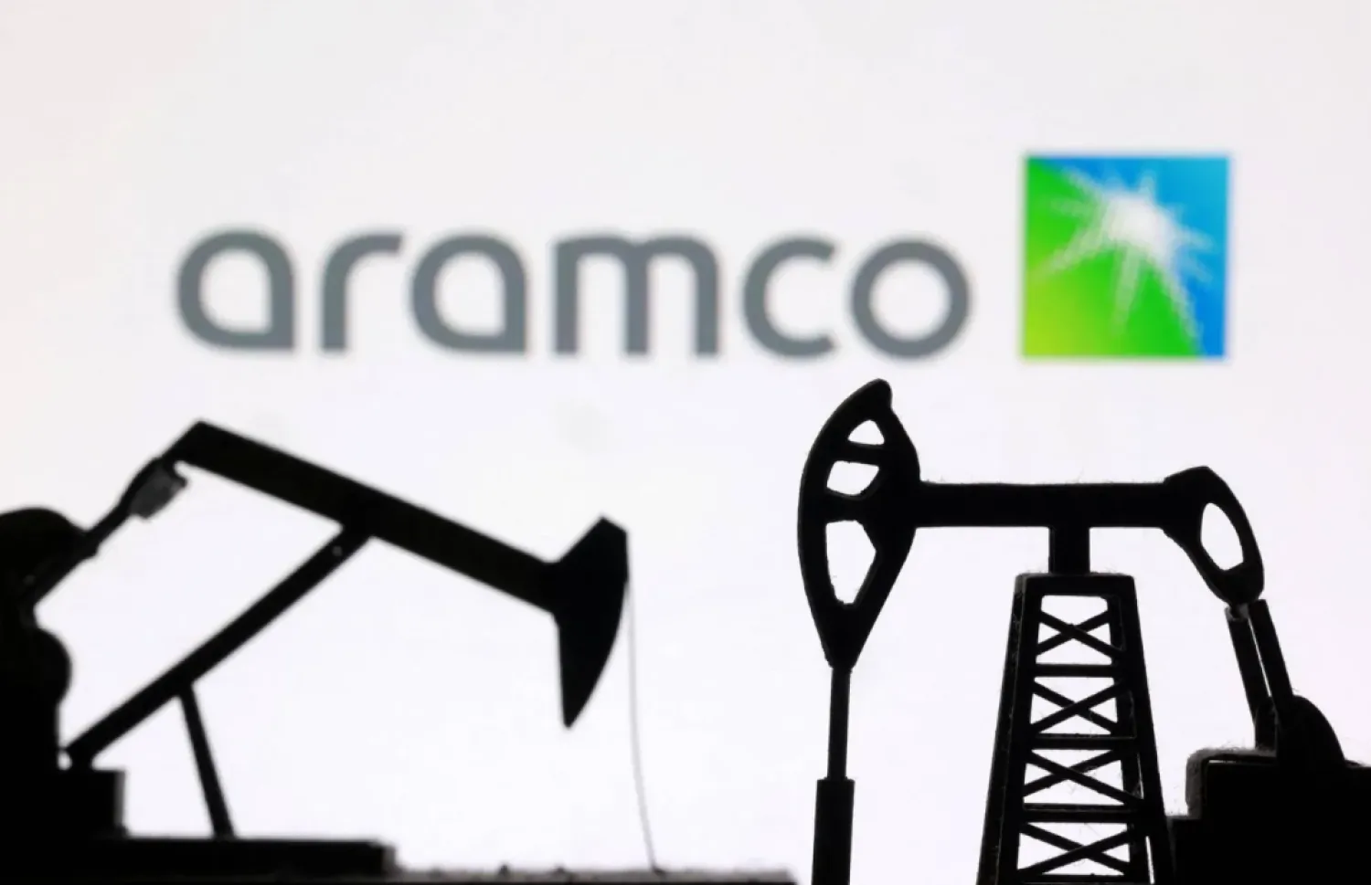 3D-printed oil pump jacks and the Saudi Aramco logo appear in this illustration taken March 2, 2026. (Reuters)
