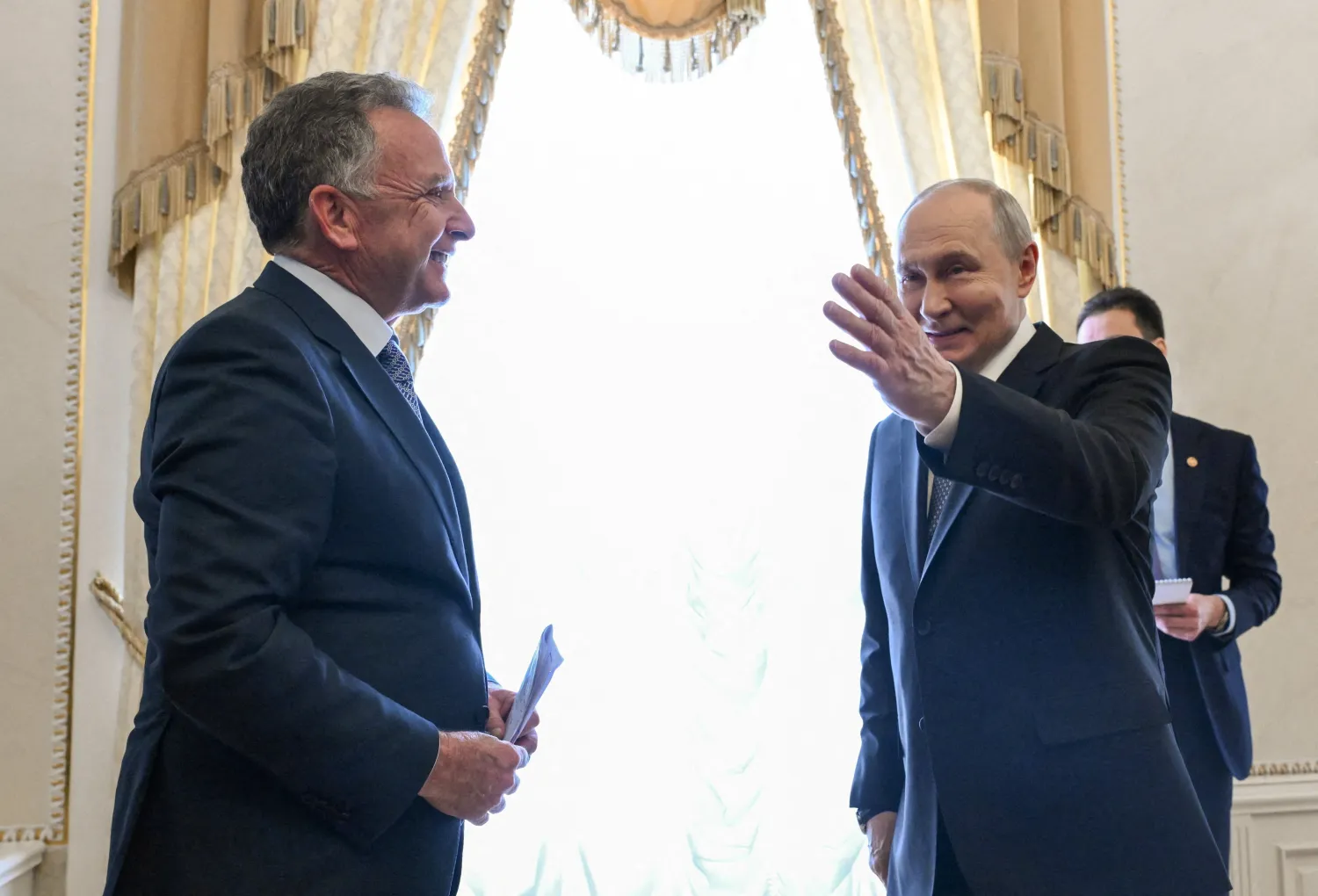Russian President Vladimir Putin shows the way to US special envoy Steve Witkoff during a meeting at the Constantine Palace in Saint Petersburg, Russia, October 21, 2026. (Sputnik/Kristina Solovyova/Pool via Reuters) 