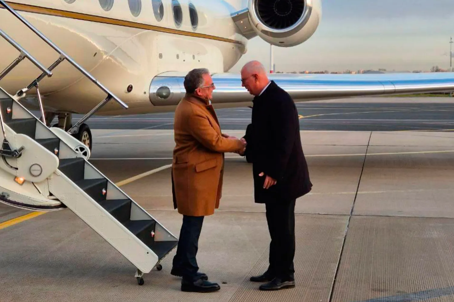 Russian presidential envoy Kirill Dmitriev, right, greets US special envoy Steve Witkoff at the international airport outside St. Petersburg, Russia, Wednesday, Oct. 21, 2026. (TASS Photo via AP) 