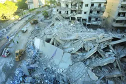 A destroyed building of Al-Qard Al-Hasan in the Shiyah area of Beirut’s southern suburbs. (AFP)