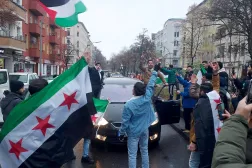 Members of the Syrian community wave Syrian flags in Berlin, Germany, and celebrate the end of Syrian dictator Bashar al-Assad's rule after opposition fighters took control of the Syrian capital Damascus on December 8, 2024. (Frank ZELLER / AFP)
