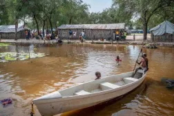 Children ride in a small canoe around the area where they live in Jonglei state, South Sudan. (Photo: AP)