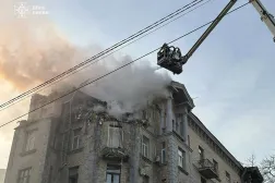 A handout photo made available by the State Emergency Service shows Ukrainian rescuers working at the site of a drone attack on a residential building in Kyiv, Ukraine, 01 January 2025, amid the ongoing Russian invasion. EPA/STATE EMERGENCY SERVICE HANDOUT  