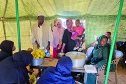 People collect food at a location set up by a local humanitarian organization to donate meals and medication to people displaced by the war in Sudan, in Meroe in the country's Northern State, on January 9, 2025. (Photo by AFP)