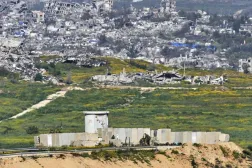 Israeli soldiers gather next to a military post on the border with Gaza Strip, in southern Israel, Tuesday, March 18, 2025. (AP Photo/Ohad Zwigenberg)