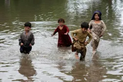 Children playing in the water after a heavy rain in Lahore, Pakistan, Sunday, July 6, 2025. (AP Photo/K.M. Chaudary)