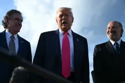 US President Donald Trump (C), flanked by US Secretary of the Interior Doug Burgum (L) and US Secretary of Commerce Howard Lutnick, speaks to reporters after stepping off Air Force One upon arrival at Joint Base Andrews, Maryland on July 15, 2025. (AFP)