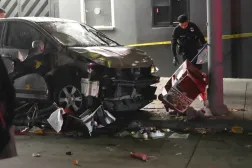A vehicle sits on the sidewalk after ramming into a crowd of people in Los Angeles early Saturday, July 19, 2025. (AP Photo/Damian Dovarganes)