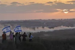  Israeli right-wing activists watch the northern Gaza Strip during a rally calling for the re-establishment of Jewish settlements in the Gaza Strip, near the border in southern Israel, Wednesday, July 30, 2025. (AP)
