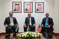 This handout picture released by the Jordanian Foreign Ministry shows (L to R) Syria's interim Foreign Minister Asaad al-Shaibani, Jordan's Foreign Minister Ayman Safadi, and US special envoy for Syria Tom Barrack meeting in Amman on August 12, 2025. (Jordanian Foreign Ministry / AFP) 