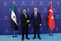 This handout photograph taken and released by the Turkish Foreign Ministry press service shows Turkish Foreign Minister Hakan Fidan (R) meeting with Syrian Foreign Minister Asaad al-Shaibani in Ankara on August 13, 2025. (Handout / Turkish Foreign Ministry / AFP) 