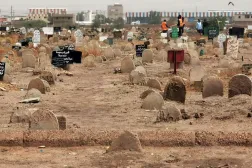 A picture taken on June 13, 2020, shows members of a forensic team at a cemetary, where a mass grave of conscripts killed in 1998 was discovered, in the Sahafa neighbourhood, south of the Sudanese capital Khartoum. © AFP (File Photo)
