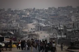 Displaced Palestinians sit next to their destroyed homes in Khan Yunis camp in the southern Gaza Strip, 05 November 2025. EPA/HAITHAM IMAD