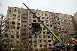 In this handout photograph taken and released by the Dnipropetrovsk Regional Military Administration on November 8, 2025, Ukrainian rescuers work at the site of a heavily damaged residential building following an air attack in Dnipro, amid the Russian invasion of Ukraine. (Photo by Handout / Dnipropetrovsk Regional Military Administration / AFP)