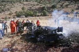 Members of the Lebanese Red Cross inspect the wreckage of a car targeted by an Israeli drone in the town of Shebaa on Saturday (EPA)