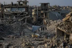 Palestinians move between destroyed buildings in Jabaliya, northern Gaza Strip, 04 November 2025, amid a ceasefire between Israel and Hamas. (EPA)
