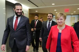 This handout picture released by the Syrian Presidency's Telegram page, shows Syria's President Ahmed al-Sharaa (L) and Syrian Foreign Minister Asaad al-Shaibani, (2nd-R) walking with International Monetary Fund (IMF) Managing Director Kristalina Georgieva ahead of their meeting in Washington D.C. on November 9, 2025. (Photo by Syrian Presidency Telegram Page / AFP)