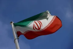 The Iranian flag waves in front of the International Atomic Energy Agency (IAEA) headquarters, before the beginning of a board of governors meeting, amid the coronavirus disease (COVID-19) outbreak in Vienna, Austria, March 1, 2021. (Reuters)
