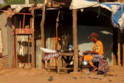A woman prepares food on the road side, amid ongoing fuel shortages caused by a blockade imposed by al Qaeda-linked insurgents in early September, in Bamako, Mali, October 31, 2025. REUTERS/Stringer 