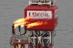 A Lukoil company sign at the Filanovskogo oil platform in the Caspian Sea, Russia, October 16, 2018. (Reuters) 