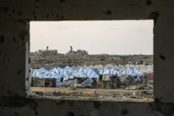A general view of a new displacement camp set up by the Egyptian Committee is pictured through a window in Nuseirat, Gaza Strip on November 11, 2025. (AFP)