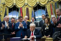 US President Donald Trump (C) signs the funding package to re-open the federal government in the Oval Office of the White House in Washington, DC, USA, 12 November 2025. EPA/BONNIE CASH / POOL