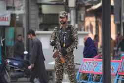 An Indian soldier stands guard in Srinagar, Indian controlled Kashmir, Wednesday, Nov. 12, 2025. (AP Photo/Mukhtar Khan)