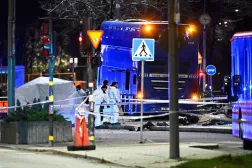 Police technicians work on the site where a bus hit into a bus shelter in Östermalm in Stockholm, Sweden, November 14, 2025. (TT News Agency/Claudio Bresciani via Reuters) 