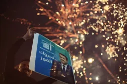 12 November 2025, Iraq, Baghdad: A supporter of Iraqi Prime Minister Mohammed Shia al-Sudani celebrates in Tahrir Square, following the announcement of preliminary election results in Baghdad. (dpa)