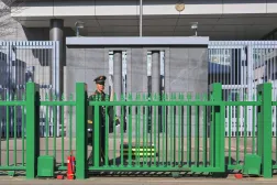 A member of security stands guard at the Japanese embassy in Beijing on November 14, 2025. (Photo by AFP) / China OUT
