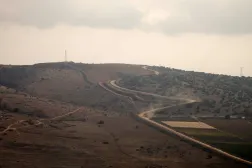 A photograph taken from the southern Lebanese village of Maroun al-Ras shows a concrete barrier wall that the Israeli army began constructing south of the Blue Line, which separates Lebanon and Israel, between the northern Israeli village of Avivim and the Lebanese area of Jal al-Deir, on November 12, 2025. (AFP)