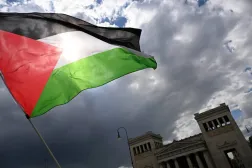 17 May 2025, Bavaria, Munich: A protester waves a Palestinian flag during a demonstration on Koenigsplatz. (dpa)
