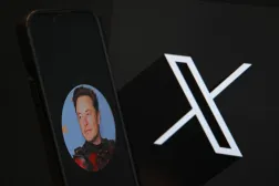 (FILES) This illustration photograph shows the logo of social network X (formerly Twitter) and a photograph of CEO of social network X, Elon Musk displayed on a smartphone in Brussels on September 27, 2024. (Photo by Nicolas TUCAT / AFP)