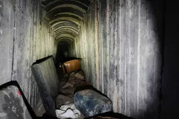 Mattresses and a plastic chair lie on the floor inside a tunnel in Rafah, Gaza Strip, Monday, Dec. 8, 2025. (AP) 