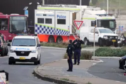 Police patrol in the early morning following a shooting Sunday at Sydney's Bondi Beach, Monday, Dec. 15, 2025. (AP Photo/Mark Baker)